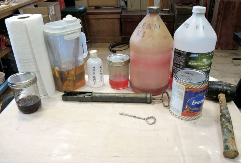 Assorted ingredients and equipment for cleaning and maintaining varnish brushes.